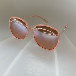 Oversize Rose gold sunglasses.